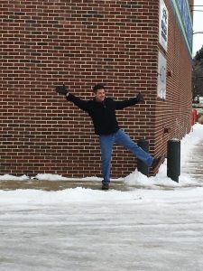 employee playing in snow