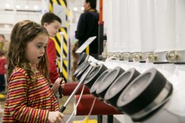 Girl Playing With Drums