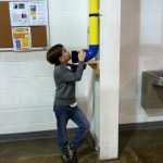 Child Playing With Whisper Tube