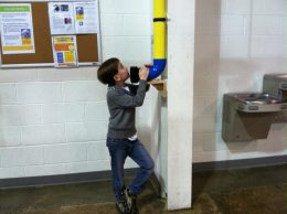 Child Playing With Whisper Tube