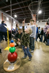 Child Playing With Lancster Science Factory Exhibit