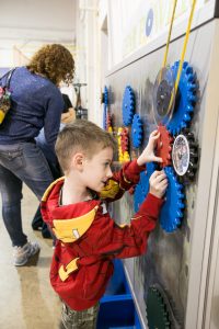 Child Playing With Lancster Science Factory Exhibit