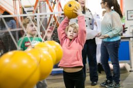Child Playing With Lancster Science Factory Exhibit
